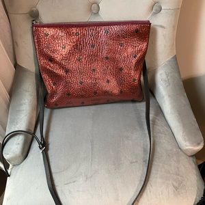 Lightly used metallic cranberry color MCM……